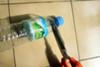Cut up a disposable water bottle and keep the neck and top,